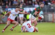 31 May 2025; Aidan O’Shea of Mayo in action against Tyrone players Cormac Quinn, 2, and Michael McKernan during the GAA Football All-Ireland Senior Championship Round 2 match between Tyrone and Mayo at O'Neills Healy Park in Omagh, Tyrone. Photo by Piaras Ó Mídheach/Sportsfile