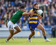 31 May 2025; Cian McKeon of Roscommon is tackled by Ciarán Caulfield of Meath during the GAA Football All-Ireland Senior Championship Round 2 match between Roscommon and Meath at King & Moffatt Dr Hyde Park in Roscommon. Photo by Tom Beary/Sportsfile