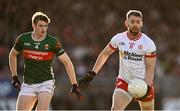 31 May 2025; Mattie Donnelly of Tyrone in action against Rory Brickenden of Mayo during the GAA Football All-Ireland Senior Championship Round 2 match between Tyrone and Mayo at O'Neills Healy Park in Omagh, Tyrone. Photo by Piaras Ó Mídheach/Sportsfile