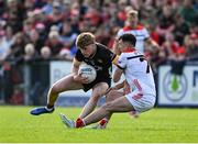 31 May 2025; Patrick McCarthy of Down in action against Craig Lennon of Louth during the GAA Football All-Ireland Senior Championship Round 2 match between Down and Louth at Páirc Esler in Newry, Down. Photo by Daire Brennan/Sportsfile