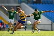 31 May 2025; Enda Smith of Roscommon is tackled by Ciarán Caulfield of Meath during the GAA Football All-Ireland Senior Championship Round 2 match between Roscommon and Meath at King & Moffatt Dr Hyde Park in Roscommon. Photo by Tom Beary/Sportsfile