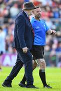 31 May 2025; Referee David Gough walks off injured with Down secretary Seán Óg McAteer at half time of the GAA Football All-Ireland Senior Championship Round 2 match between Down and Louth at Páirc Esler in Newry, Down. Photo by Daire Brennan/Sportsfile