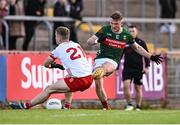 31 May 2025; Darren McHale of Mayo scores his side's first goal despite the efforts of Ben McDonnell of Tyrone during the GAA Football All-Ireland Senior Championship Round 2 match between Tyrone and Mayo at O'Neills Healy Park in Omagh, Tyrone. Photo by Piaras Ó Mídheach/Sportsfile