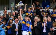 31 May 2025; Tipperary captain Sam O'Farrell lifts the James Nowlan Cup as Leinster Council chairman Derek Kent, left, Tony Towell, Managing Director, O'Neills International Sports Company Ltd, and Michael Lowry, TD for the Tipperary North constituency after the oneills.com GAA Hurling All-Ireland U20 Championship final match between Kilkenny and Tipperary at UPMC Nowlan Park in Kilkenny. Photo by Ray McManus/Sportsfile