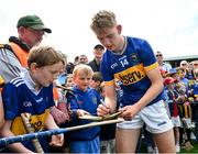 31 May 2025; Paddy McCormack of Tipperary signs autographs after the oneills.com GAA Hurling All-Ireland U20 Championship final match between Kilkenny and Tipperary at UPMC Nowlan Park in Kilkenny. Photo by Ray McManus/Sportsfile