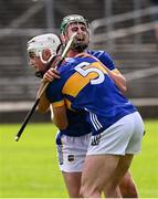 31 May 2025; Tipperary players Adam Ryan, 5, and captain Sam O'Farrell celebrate after the oneills.com GAA Hurling All-Ireland U20 Championship final match between Kilkenny and Tipperary at UPMC Nowlan Park in Kilkenny. Photo by Ray McManus/Sportsfile