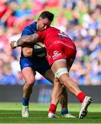 31 May 2025; Hugo Keenan of Leinster is tackled by Vaea Fifita of Scarlets, resulting in a yellow card for Fifita, during the United Rugby Championship quarter-final match between Leinster and Scarlets at the Aviva Stadium in Dublin. Photo by Brendan Moran/Sportsfile
