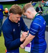 31 May 2025; Leinster mascot Conor Clarke with Jordie Barrett before the United Rugby Championship quarter-final match between Leinster and Scarlets at the Aviva Stadium in Dublin. Photo by Brendan Moran/Sportsfile