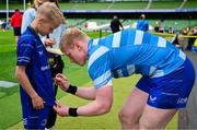 31 May 2025; Leinster mascot Leo Priestman with Jamie Osborne before the United Rugby Championship quarter-final match between Leinster and Scarlets at the Aviva Stadium in Dublin. Photo by Brendan Moran/Sportsfile