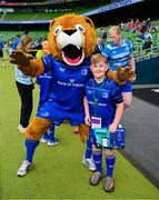 31 May 2025; Leinster mascot Conor Clarke with Leo the Lion before the United Rugby Championship quarter-final match between Leinster and Scarlets at the Aviva Stadium in Dublin. Photo by Brendan Moran/Sportsfile