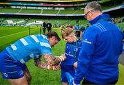 31 May 2025; Leinster mascot Conor Clarke with Andrew Porter before the United Rugby Championship quarter-final match between Leinster and Scarlets at the Aviva Stadium in Dublin. Photo by Brendan Moran/Sportsfile