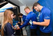 31 May 2025; Leinster players John McKee, Paddy McCarthy and James Culhane with supporters in Autograph Alley before the United Rugby Championship quarter-final match between Leinster and Scarlets at the Aviva Stadium in Dublin. Photo by Seb Daly/Sportsfile