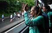 1 June 2025; Republic of Ireland's Grace Moloney, Chloe Mustaki, right, and team-mates encourage participants in the Cork City Marathon on their way to a Republic of Ireland women's training session at Turner's Cross in Cork. Photo by Stephen McCarthy/Sportsfile
