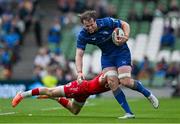 31 May 2025; Ryan Baird of Leinster is tackled by Arhie Hughes of Scarlets during the United Rugby Championship quarter-final match between Leinster and Scarlets at the Aviva Stadium in Dublin. Photo by Brendan Moran/Sportsfile