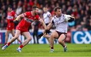 1 June 2025; Paul Conroy of Galway in action against Niall Loughlin of Derry during the GAA Football All-Ireland Senior Championship Round 2 match between Derry and Galway at Celtic Park in Derry. Photo by Piaras Ó Mídheach/Sportsfile