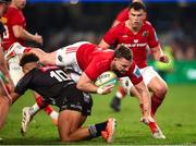 31 May 2025; Rory Scannell of Munster is tackled by Jordan Hendrikse of Hollywoodbets Sharks during the United Rugby Championship quarter-final match between Hollywoodbets Sharks and Munster at Kings Park Stadium in Durban, South Africa. Photo by Shaun Roy/Sportsfile