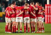 31 May 2025; Munster huddle before the start of extra time during the United Rugby Championship quarter-final match between Hollywoodbets Sharks and Munster at Kings Park Stadium in Durban, South Africa. Photo by Shaun Roy/Sportsfile