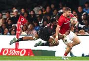 31 May 2025; Makazole Mapimpi of Hollywoodbets Sharks tackles Diarmuid Kilgallen of Munster during the United Rugby Championship quarter-final match between Hollywoodbets Sharks and Munster at Kings Park Stadium in Durban, South Africa. Photo by Shaun Roy/Sportsfile