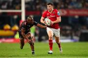 31 May 2025; Tom Farrell of Munster in action as Makazole Mapimpi of Hollywoodbets Sharks attempts to make the tackle during the United Rugby Championship quarter-final match between Hollywoodbets Sharks and Munster at Kings Park Stadium in Durban, South Africa. Photo by Shaun Roy/Sportsfile