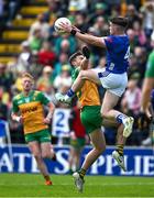 1 June 2025; Cian Reilly of Cavan in action against Conor O'Donnell of Donegal during the GAA Football All-Ireland Senior Championship Round 2 match between Cavan and Donegal at Kingspan Breffni in Cavan. Photo by Brendan Moran/Sportsfile