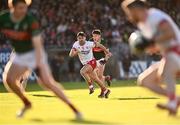 31 May 2025; Darren McCurry of Tyrone makes a support run, chased by Enda Hession of Mayo, as Mattie Donnelly of Tyrone goes on the attack during the GAA Football All-Ireland Senior Championship Round 2 match between Tyrone and Mayo at O'Neills Healy Park in Omagh, Tyrone. Photo by Piaras Ó Mídheach/Sportsfile