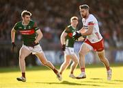 31 May 2025; Mattie Donnelly of Tyrone in action against Rory Brickenden of Mayo during the GAA Football All-Ireland Senior Championship Round 2 match between Tyrone and Mayo at O'Neills Healy Park in Omagh, Tyrone. Photo by Piaras Ó Mídheach/Sportsfile