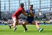 31 May 2025; James Lowe of Leinster in action against Tom Rogers of Scarlets during the United Rugby Championship quarter-final match between Leinster and Scarlets at the Aviva Stadium in Dublin. Photo by Seb Daly/Sportsfile