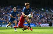 31 May 2025; Jordie Barrett of Leinster is tackled by Joe Roberts of Scarlets during the United Rugby Championship quarter-final match between Leinster and Scarlets at the Aviva Stadium in Dublin. Photo by Seb Daly/Sportsfile