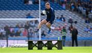 1 June 2025; The Dublin captain Ciaran Kilkenny leaps the bench before the traditional team photograph for the GAA Football All-Ireland Senior Championship Round 2 match between Dublin and Armagh at Croke Park in Dublin. Photo by Ray McManus/Sportsfile