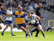 1 June 2025; Killian Lavelle of Monaghan in action against Alan Sweeney of Clare during the GAA Football All-Ireland Senior Championship Round 2 match between Monaghan and Clare at St Tiernach’s Park in Clones, Monaghan. Photo by Michael P Ryan/Sportsfile