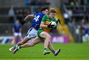 1 June 2025; Ciarán Moore of Donegal is tackled by Oisin Brady of Cavan during the GAA Football All-Ireland Senior Championship Round 2 match between Cavan and Donegal at Kingspan Breffni in Cavan. Photo by Brendan Moran/Sportsfile
