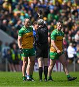 1 June 2025; Michael Murphy of Donegal is shown a yellow card by referee Fergal Kelly during the GAA Football All-Ireland Senior Championship Round 2 match between Cavan and Donegal at Kingspan Breffni in Cavan. Photo by Brendan Moran/Sportsfile