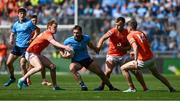 1 June 2025; Sean MacMahon of Dublin in action against Armagh players, left to right, Conor Turbitt, Rian O'Neill, and Andrew Murnin during the GAA Football All-Ireland Senior Championship Round 2 match between Dublin and Armagh at Croke Park in Dublin. Photo by Daire Brennan/Sportsfile