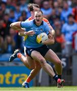 1 June 2025; Peadar Ó Cofaigh Byrne of Dublin is tackled by Barry McCambridge of Armagh during the GAA Football All-Ireland Senior Championship Round 2 match between Dublin and Armagh at Croke Park in Dublin. Photo by Ray McManus/Sportsfile