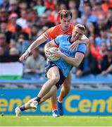 1 June 2025; Paddy Small of Dublin is tackled by Barry McCambridge of Armagh during the GAA Football All-Ireland Senior Championship Round 2 match between Dublin and Armagh at Croke Park in Dublin. Photo by Ray McManus/Sportsfile