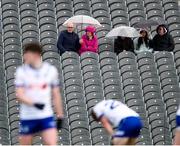 1 June 2025; Spectators shelter from the rain during the GAA Football All-Ireland Senior Championship Round 2 match between Monaghan and Clare at St Tiernach’s Park in Clones, Monaghan. Photo by Michael P Ryan/Sportsfile