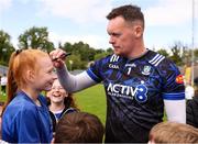 1 June 2025; Monaghan goalkeeper Rory Beggan signs a supporters forehead after the GAA Football All-Ireland Senior Championship Round 2 match between Monaghan and Clare at St Tiernach’s Park in Clones, Monaghan. Photo by Michael P Ryan/Sportsfile