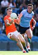1 June 2025; Oisin Conaty of Armagh is tackled by Brian Howard of Dublin during the GAA Football All-Ireland Senior Championship Round 2 match between Dublin and Armagh at Croke Park in Dublin. Photo by Ray McManus/Sportsfile