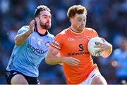1 June 2025; Jason Duffy of Armagh is tackled by Sean MacMahon of Dublin  during the GAA Football All-Ireland Senior Championship Round 2 match between Dublin and Armagh at Croke Park in Dublin. Photo by Ray McManus/Sportsfile