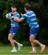 2 June 2025; Hugo Keenan, left, and John McKee during a Leinster Rugby squad training session at UCD in Dublin. Photo by Shauna Clinton/Sportsfile