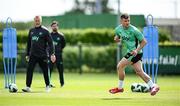 2 June 2025; Josh Honohan, watched by head coach Heimir Hallgrimsson, during a Republic of Ireland training session at the FAI National Training Centre in Abbotstown, Dublin. Photo by Seb Daly/Sportsfile