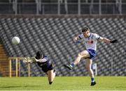 1 June 2025; Stephen O'Hanlon of Monaghan has a shot on goal despite the attention of Clare goalkeeper Eamon Tubridy during the GAA Football All-Ireland Senior Championship Round 2 match between Monaghan and Clare at St Tiernach’s Park in Clones, Monaghan. Photo by Michael P Ryan/Sportsfile