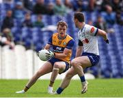 1 June 2025; Daniel Walsh of Clare in action against David Garland of Monaghan during the GAA Football All-Ireland Senior Championship Round 2 match between Monaghan and Clare at St Tiernach’s Park in Clones, Monaghan. Photo by Michael P Ryan/Sportsfile