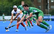 2 June 2025; Mark McNellis of Ireland in action against Mandeep Singh of India during the Men's International Hockey match between Ireland and India at Pembroke Wanderers Hockey Club in Dublin. Photo by Shauna Clinton/Sportsfile
