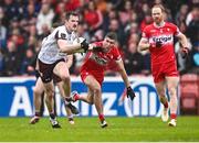 1 June 2025; Céin D’Arcy of Galway in action against Ciarán McFaul of Derry during the GAA Football All-Ireland Senior Championship Round 2 match between Derry and Galway at Celtic Park in Derry. Photo by Piaras Ó Mídheach/Sportsfile