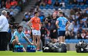 1 June 2025; Armagh captain Rory Grugan, left, and Dublin captain Ciaran Kilkenny watch as referee Joe McQuillan tosses a coin to decide ends before the GAA Football All-Ireland Senior Championship Round 2 match between Dublin and Armagh at Croke Park in Dublin. Photo by Ray McManus/Sportsfile