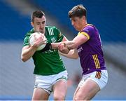 1 June 2025; Garvan Jones of Fermanagh is tackled by Gavin Sheehan of Wexford during the Tailteann Cup match between Fermanagh and Wexford at Croke Park in Dublin. Photo by Ray McManus/Sportsfile