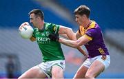 1 June 2025; Garvan Jones of Fermanagh is tackled by Gavin Sheehan of Wexford during the Tailteann Cup match between Fermanagh and Wexford at Croke Park in Dublin. Photo by Ray McManus/Sportsfile