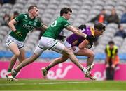 1 June 2025; Gavin Sheehan of Wexford is tackled by Conor McGee, left, and Josh Largo Elis of Fermanagh during the Tailteann Cup match between Fermanagh and Wexford at Croke Park in Dublin. Photo by Ray McManus/Sportsfile