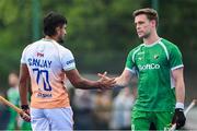2 June 2025; Lee Cole of Ireland and Sanjay of India shake hands after the Men's International Hockey match between Ireland and India at Pembroke Wanderers Hockey Club in Dublin. Photo by Shauna Clinton/Sportsfile
